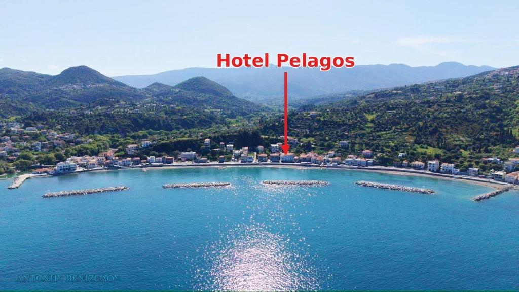an aerial view of a lake with a red pole at Hotel Pelagos Studios in Platána