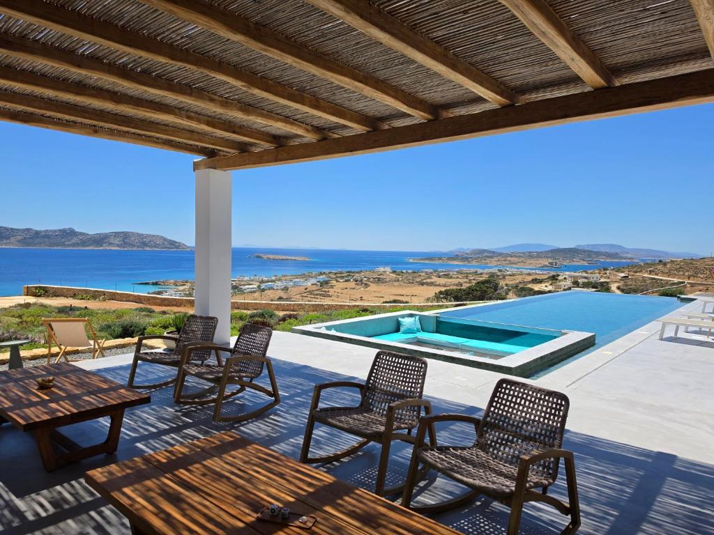 a patio with chairs and a swimming pool at Lefki Sokolata in Koufonisia