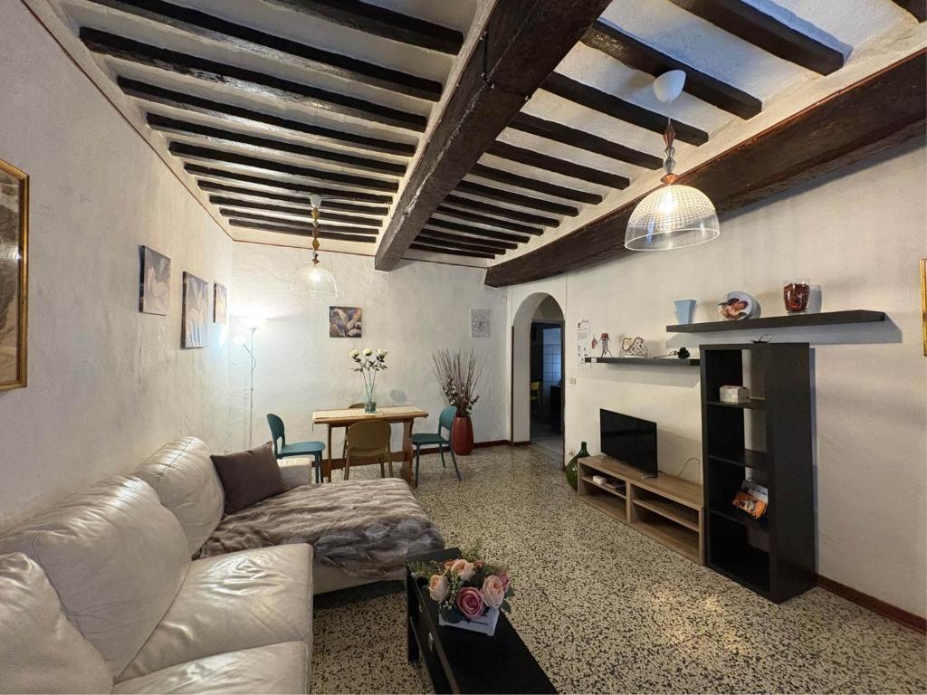 a living room with a couch and a table at Casa Zia Seconda in Montecatini Val di Cecina