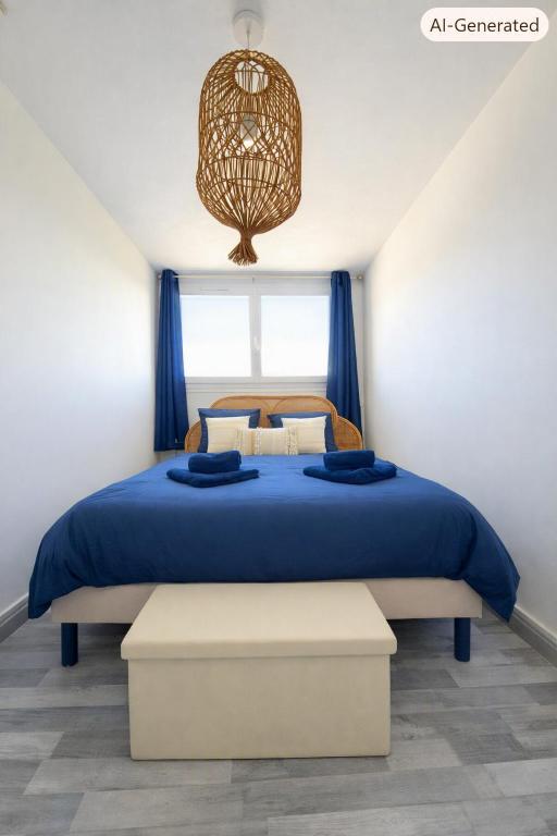 a bedroom with a blue bed and a chandelier at L'échappée Seine - Idéalement situé in Barentin