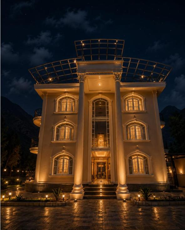a large white building with a lot of windows at night at Vale Montis Near Dal Lake Srinagar in Srinagar
