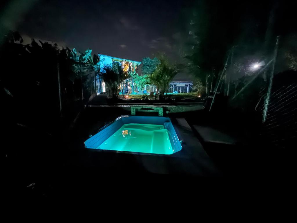 a swimming pool in a dark room at night at Villa Mara in Filandia