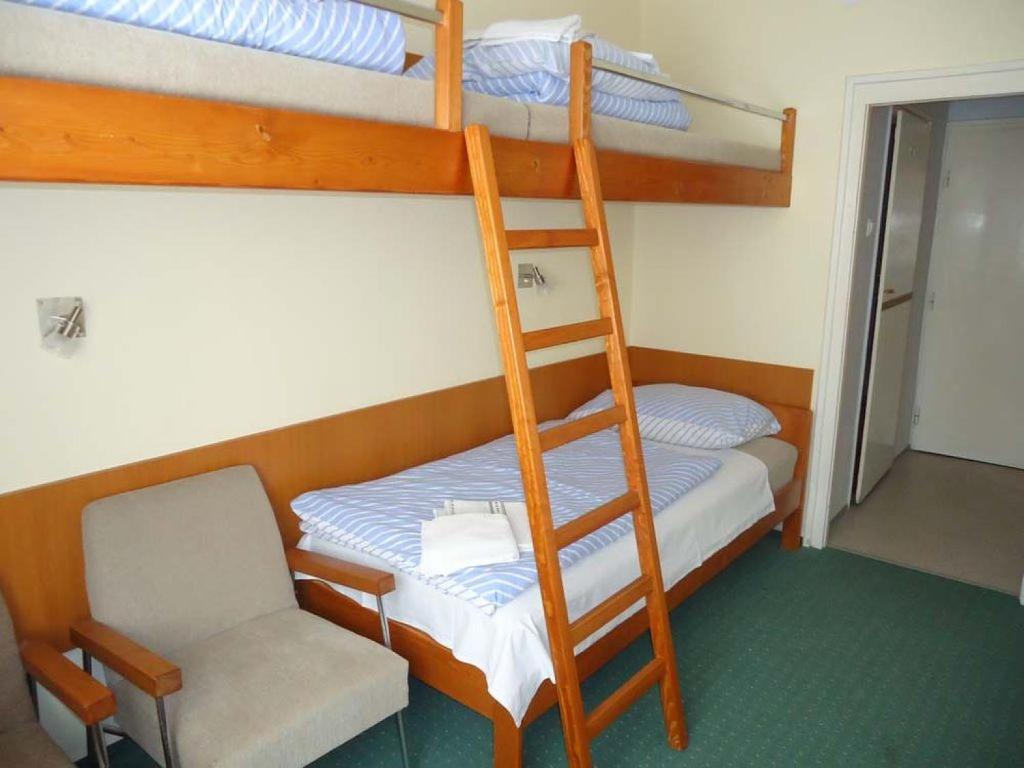Postel nebo postele na pokoji v ubytování Hotel Touring