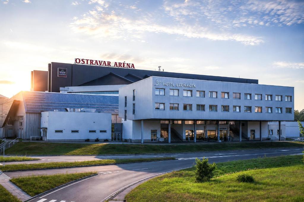 a large white building with a road in front of it at Hotel Ledňáček in Ostrava