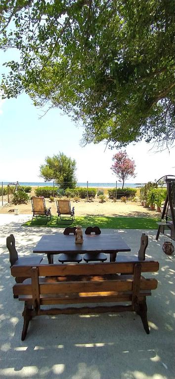 a picnic table with a cat sitting on top of it at Mareliva Retreat in Trinísia
