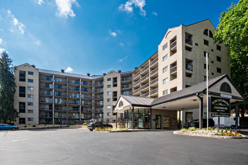 a large building with a parking lot in front of it at Olde Gatlinburg Rentals in Gatlinburg