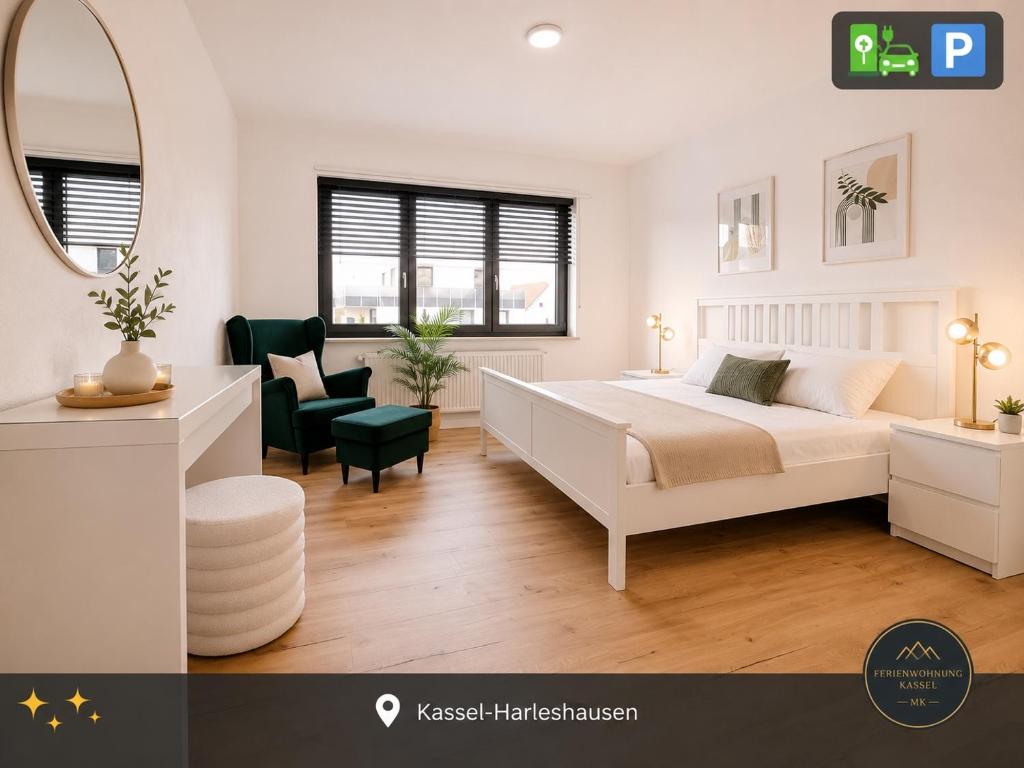 a bedroom with a white bed and a mirror at Ferienwohnung Kassel mit Ladesäule & Balkon in Kassel