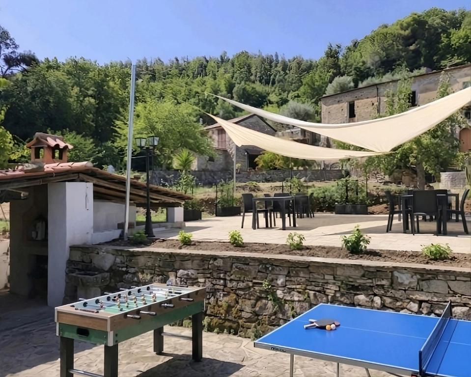 a ping pong table in the middle of a patio at Antica Residenza in Perdifumo