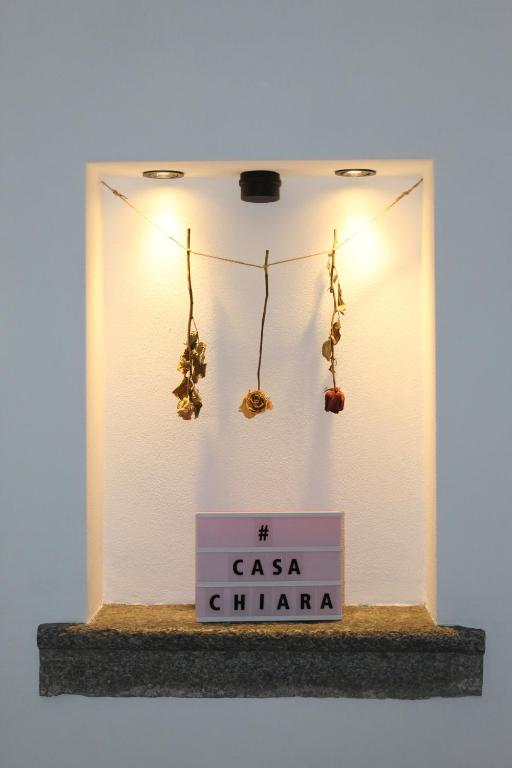 a shelf with a sign that says csa china at Casa Chiara in Mandello del Lario