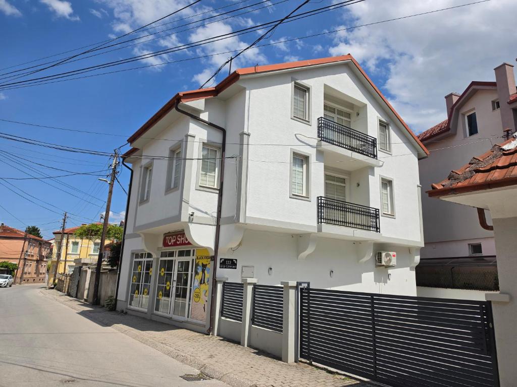 a white building on the side of a street at Villa Continental in Bitola