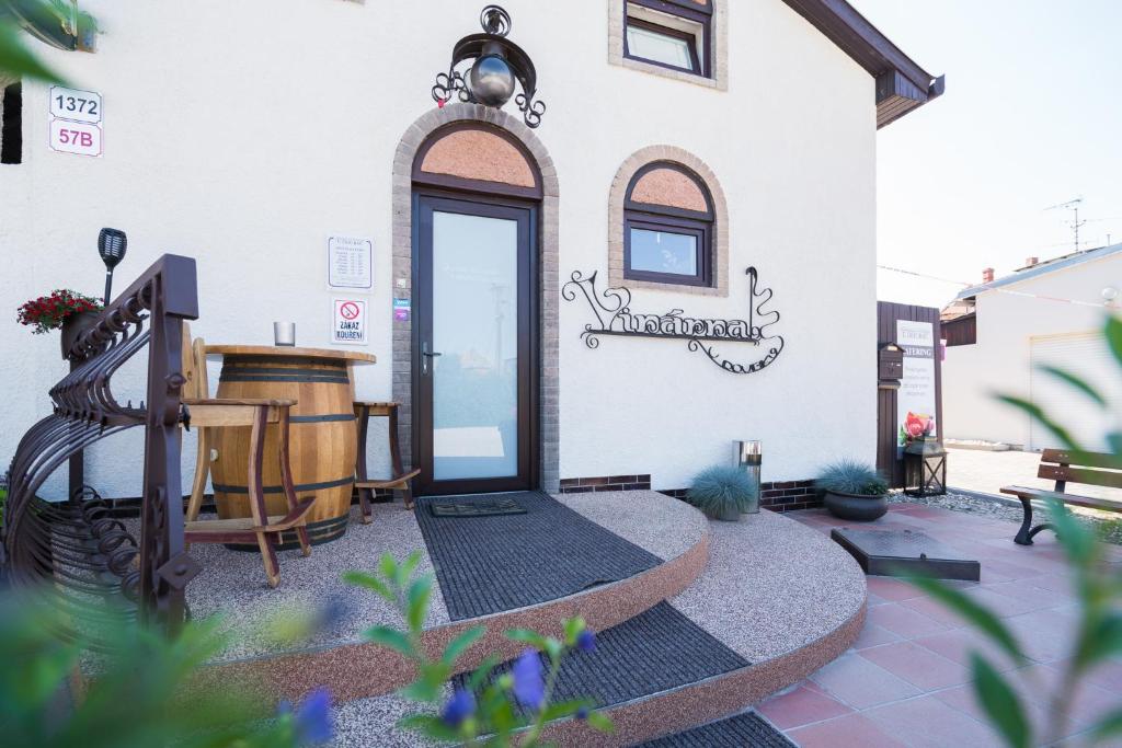 a building with a sign on the side of it at RESTAURACE A PENZION U DOUBKŮ in Břeclav