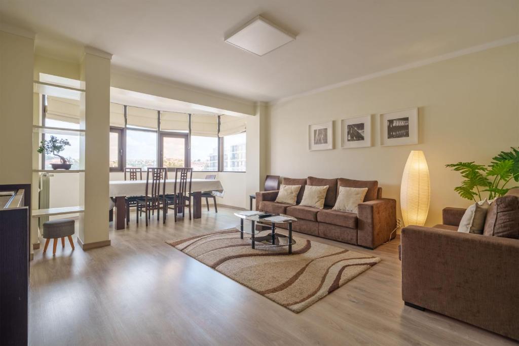 a living room with a couch and a table at StaynFeel 03 in Fátima