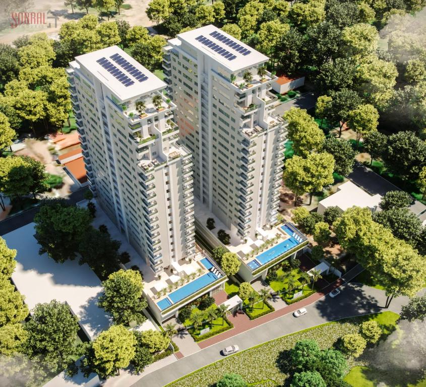 an overhead view of two tall buildings with trees at Studio Design 305 in Sobral