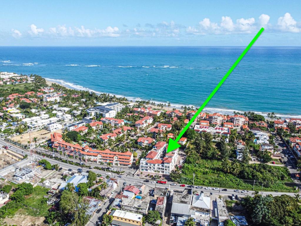 an aerial view of a city with a green line at Novus Mare, Cabarete center! in Cabarete