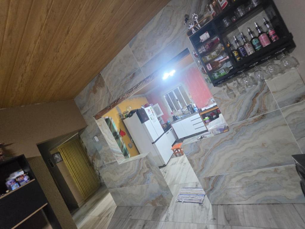 an overhead view of a kitchen with a stone wall at Chácara pedaçoDcéu in Cavalcante
