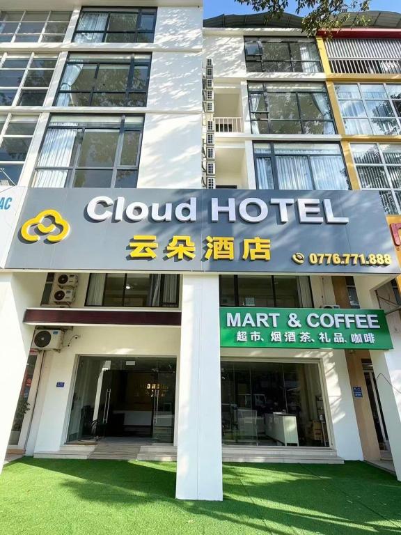 a building with a sign for a global hotel at The Cloud Hotel Bình Dương in Ga Phú Trung