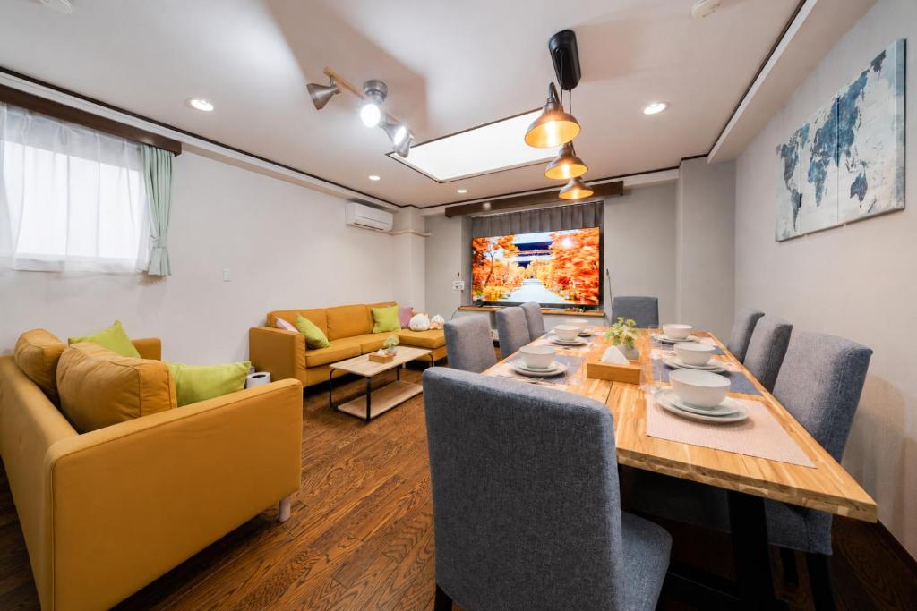 a dining room with a table and chairs at HOTEL CtrlD ASAGAYA Spacious 130 Square Meter Apartment 4 Bedrooms 7 Beds 3 Minute Walk from JR Asagaya Station in Tokyo