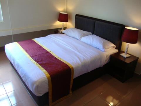 Postel nebo postele na pokoji v ubytování DM Hotel