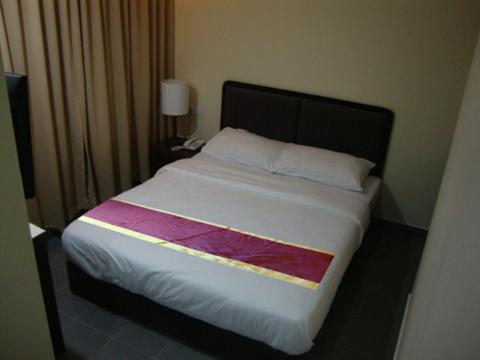 Postel nebo postele na pokoji v ubytování DM Hotel