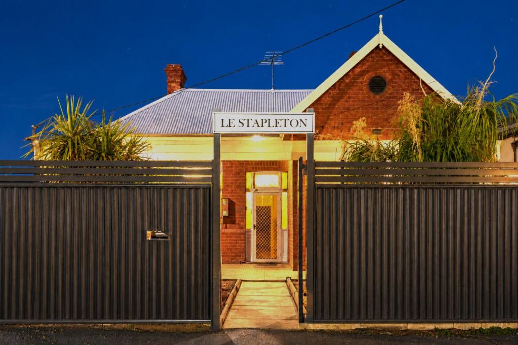 a house with a gate in front of it at The Stapleton in Kalgoorlie