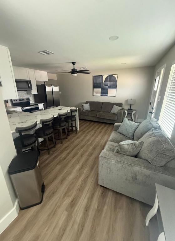 a living room with a couch and a table at Only minutes away from Surfside Beach in Freeport