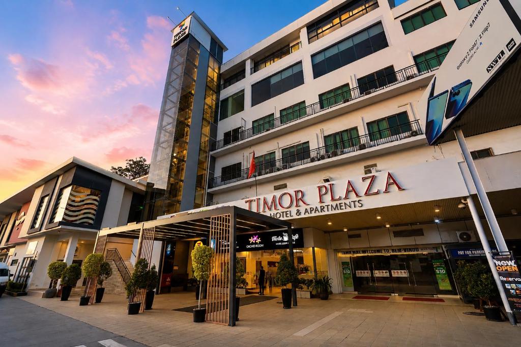 a building with a sign in front of it at Timor Plaza Hotel & Apartments in Dili