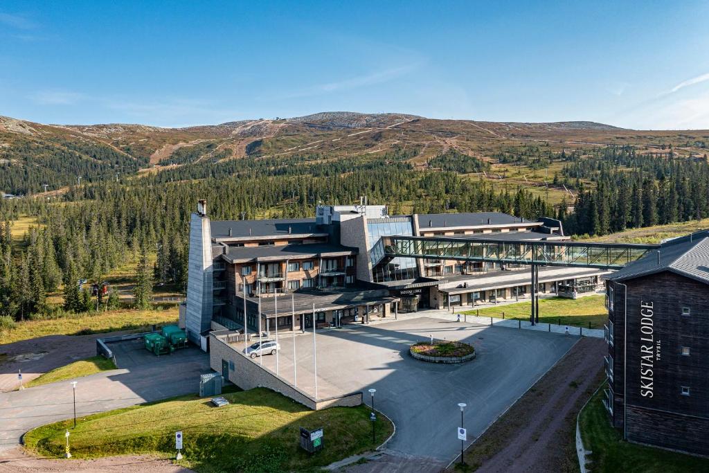 an aerial view of a building with mountains in the background at Skistar Lodge Trysil in Trysil