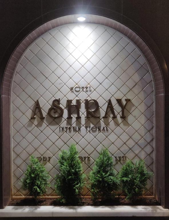 a store window with the sign for a mall at HOTEL ASHRAY INTERNATIONAL, SION - Near BKC in Mumbai