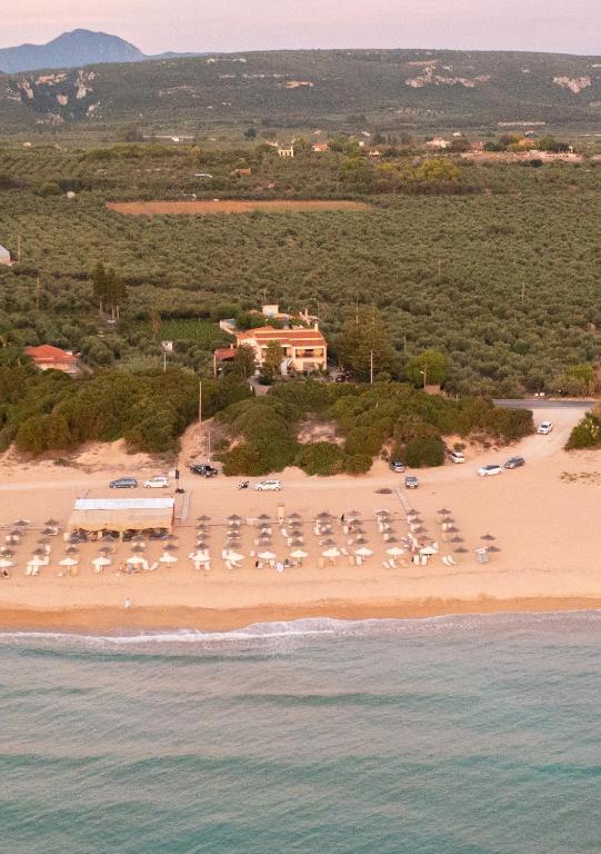 an aerial view of a beach with umbrellas at Lagouvardos Beach House in Marathopoli