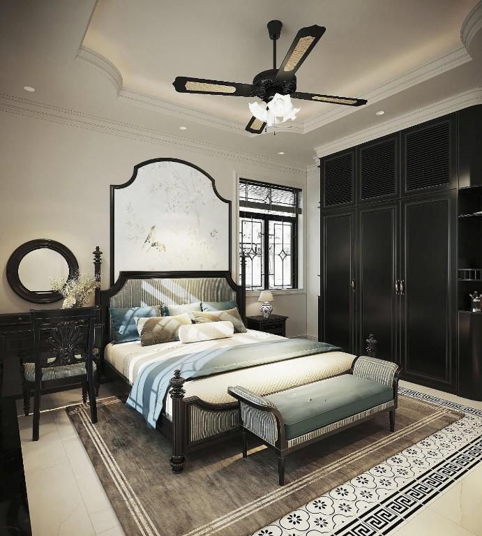 a bedroom with a bed and a ceiling fan at Grand KAS Premium Hotel & Sky Bar in Ho Chi Minh City
