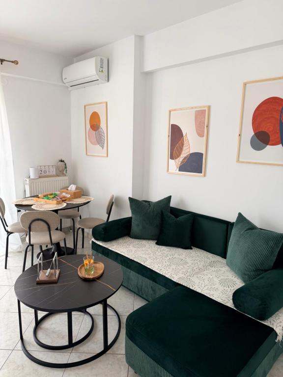 a living room with a couch and a table at The View Xanthi in Xanthi
