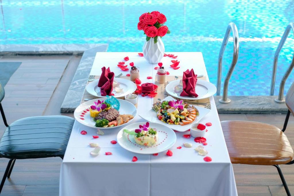 A decorated meal set beside the hotel swimming pool.