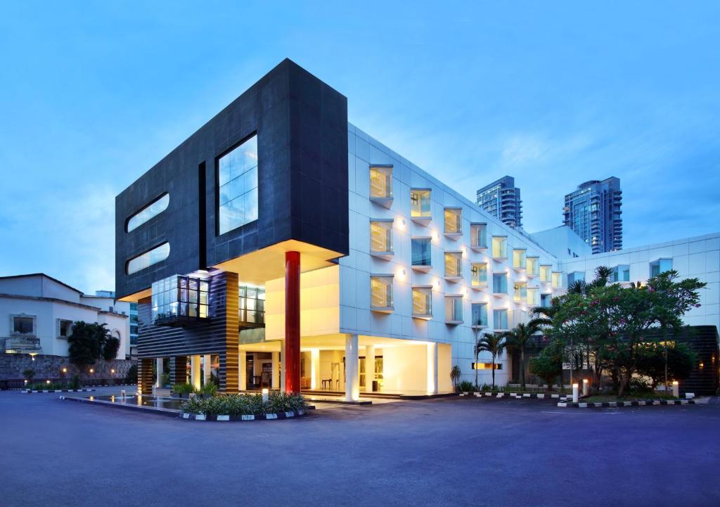 a building in a city with tall buildings at Grandkemang Hotel in Jakarta