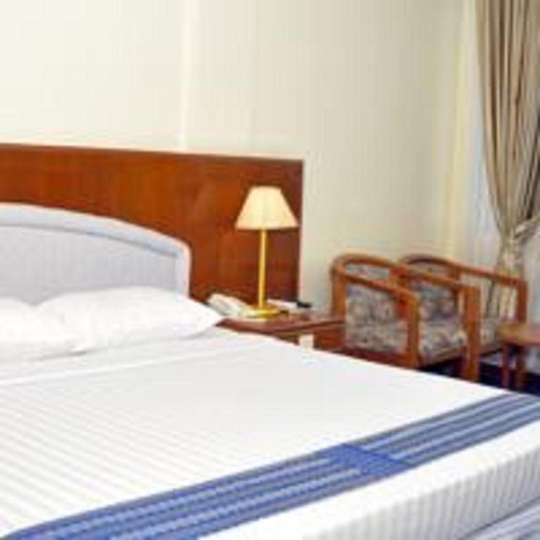Postel nebo postele na pokoji v ubytování Panorama Hotel