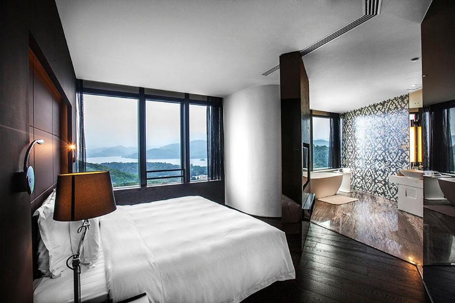 Postel nebo postele na pokoji v ubytování Shenzhen O Hotel