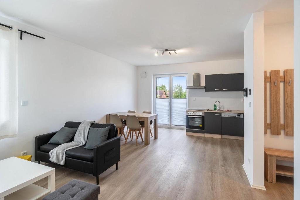 a living room with a couch and a table at Haus Seeluft - W4 in Butjadingen