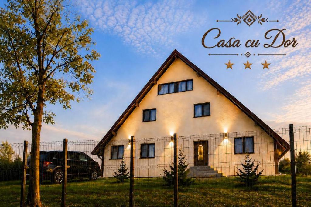 a house with a sign that reads casas an do at Casa cu Dor in Odăile
