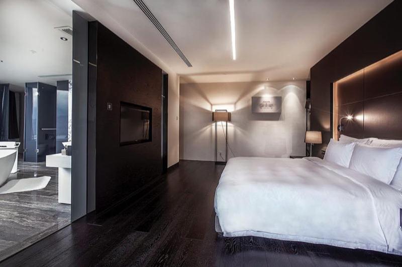 Postel nebo postele na pokoji v ubytování Shenzhen O Hotel