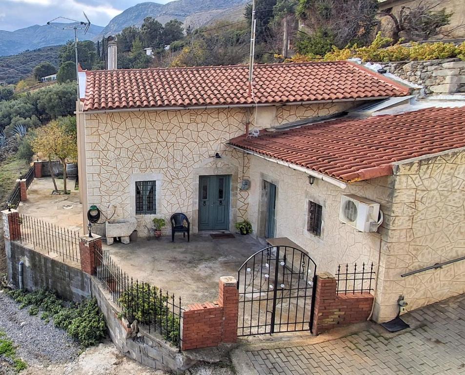 an aerial view of a house with a yard at IRENE'S village home in Loutrákion