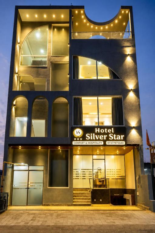 a building with a hotel silver star sign on it at Hotel Silver Star in Greater Noida