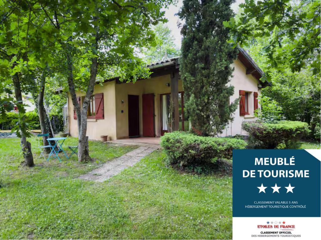 a house with a sign in front of it at Le Pountou Grand Parc Nature Calme WIFI in Rieux-de-Pelleport