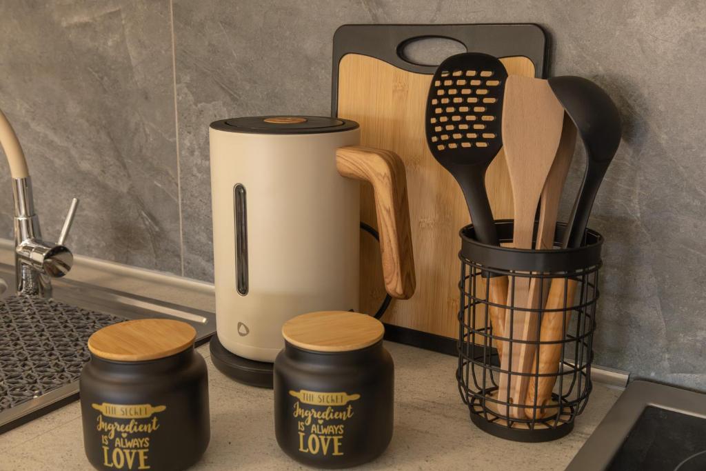 a counter top with a kitchen utensils and a coffee maker at Casa Berardo in Megara