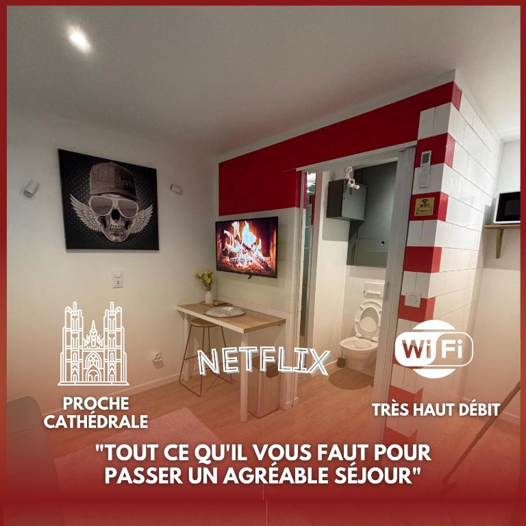 a bathroom with a skull on the wall at Le cozy Cathedral Reims in Reims