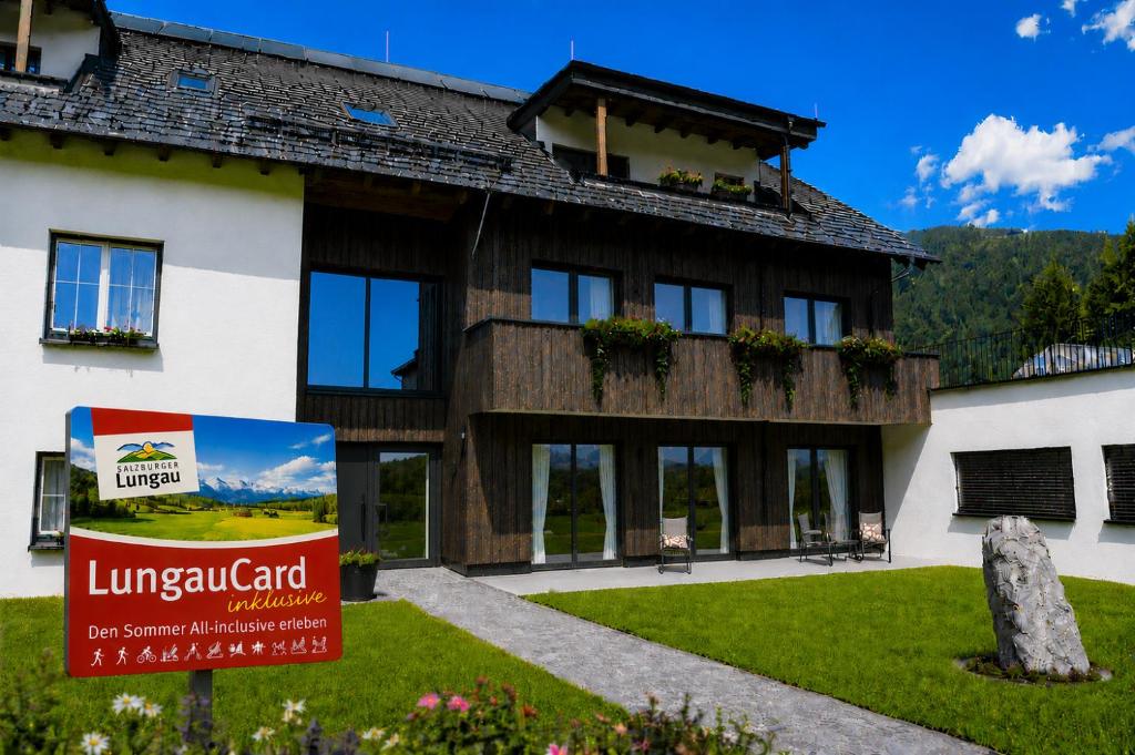 a large building with a sign in front of it at Fewo Mauterndorf in Mauterndorf