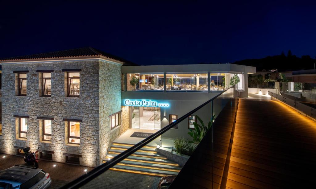 a building with a sign that reads great pholis at Creta Palm Resort Hotel & Apartments in Stalos