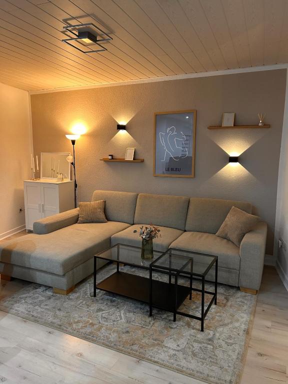 a living room with a couch and a table at Ferienwohnung Noela in Sankt Ingbert