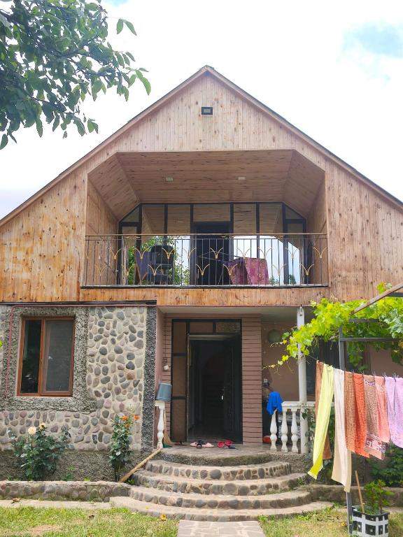 a house with a balcony on top of it at biker s home in Nabakhtevi