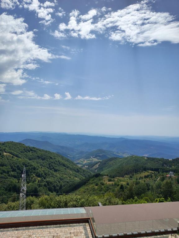 a view of the mountains from the roof of a building at Aurora Kopaonik in Raška
