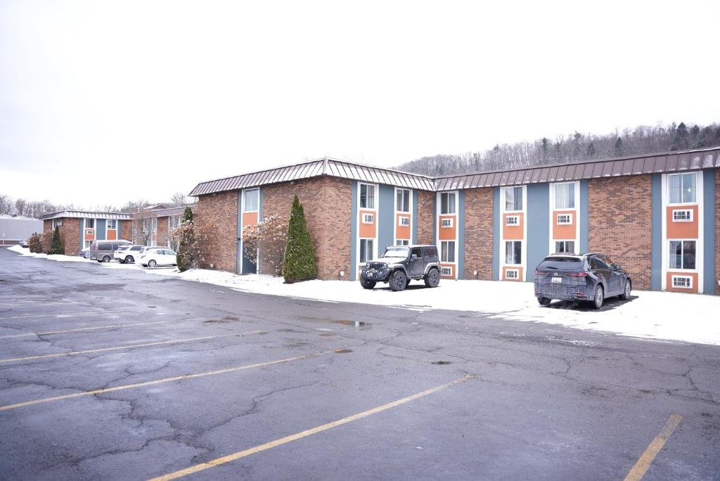an empty parking lot in front of a building at Kiteville Owego in Owego