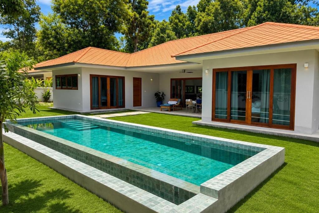 a house with a swimming pool in front of it at Tropical villa - Private pool - 3 bedrooms in Ko Phangan